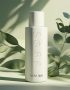 Create an image of a simple skincare bottle with soft botanical shadows in the background brand name SGM 360
